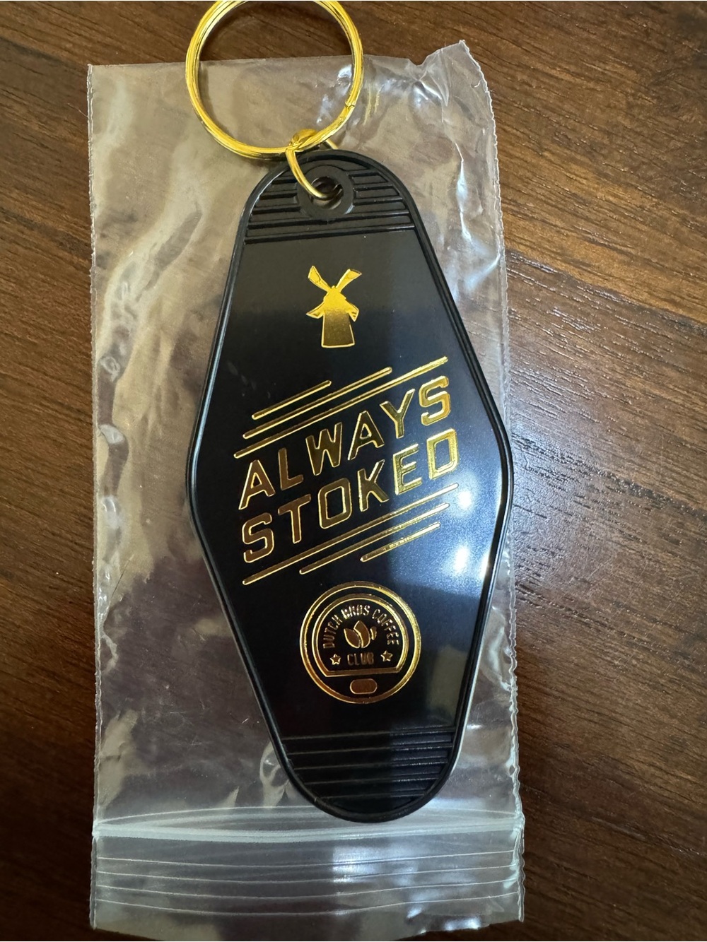 Dutch Bros Black and Gold "Always Stoked" Keychain